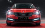 Front view of 2024 Škoda Superb Sportline 4x4 sedan in red with gloss black grille and LED Matrix headlights – overseas model shown