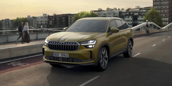 A modern Skoda Karoq SUV in a distinctive mustard yellow finish